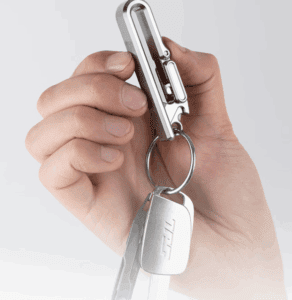 a hand holding a key chain