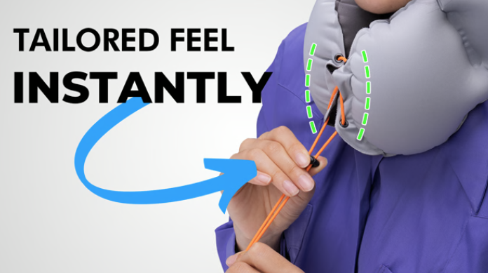 a person holding a grey vest