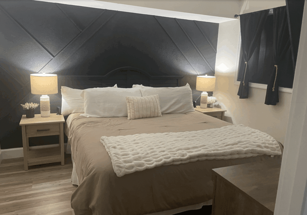 a bed with pillows and a blanket