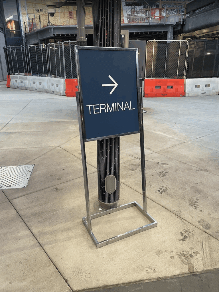 a sign on a sidewalk