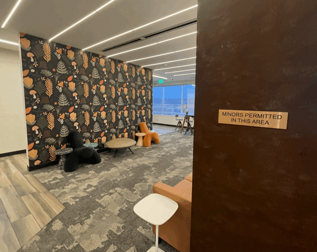 a room with a wallpaper and chairs