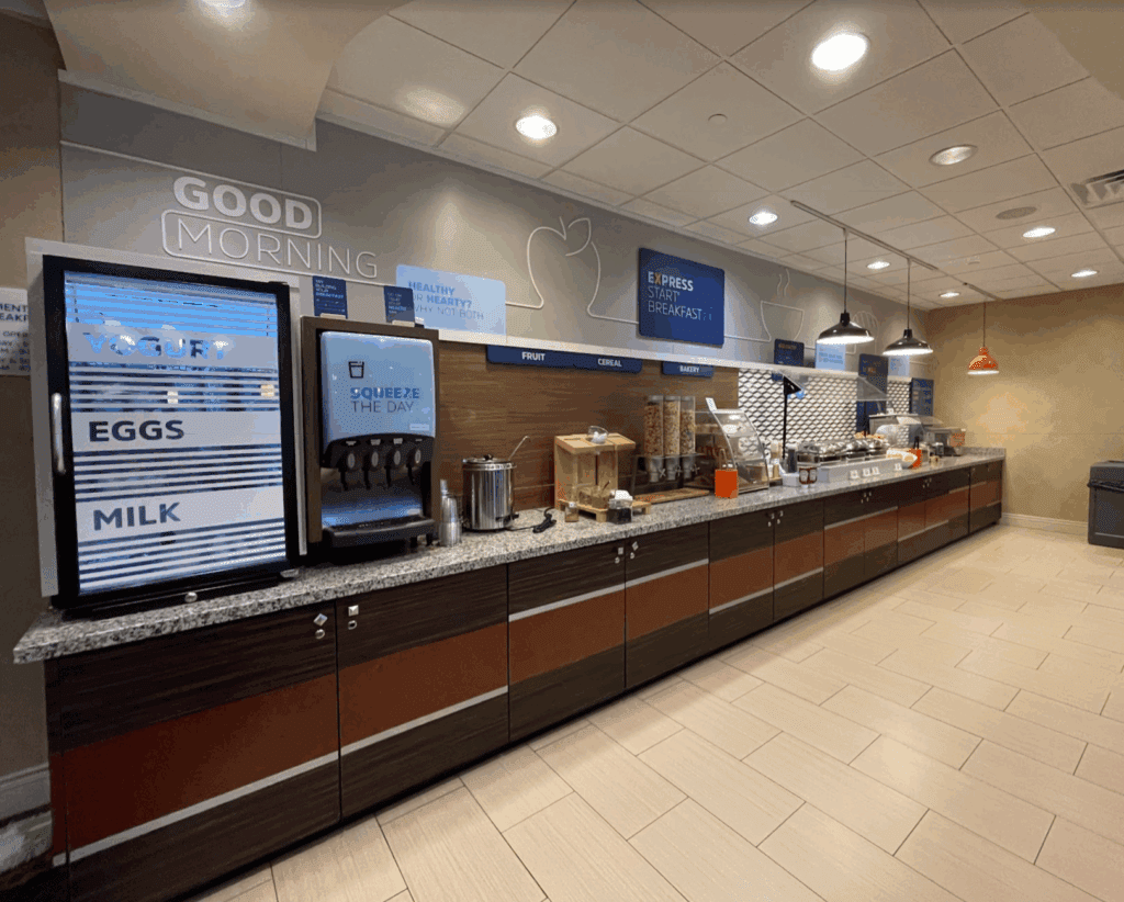 a coffee machine and drinks on a counter