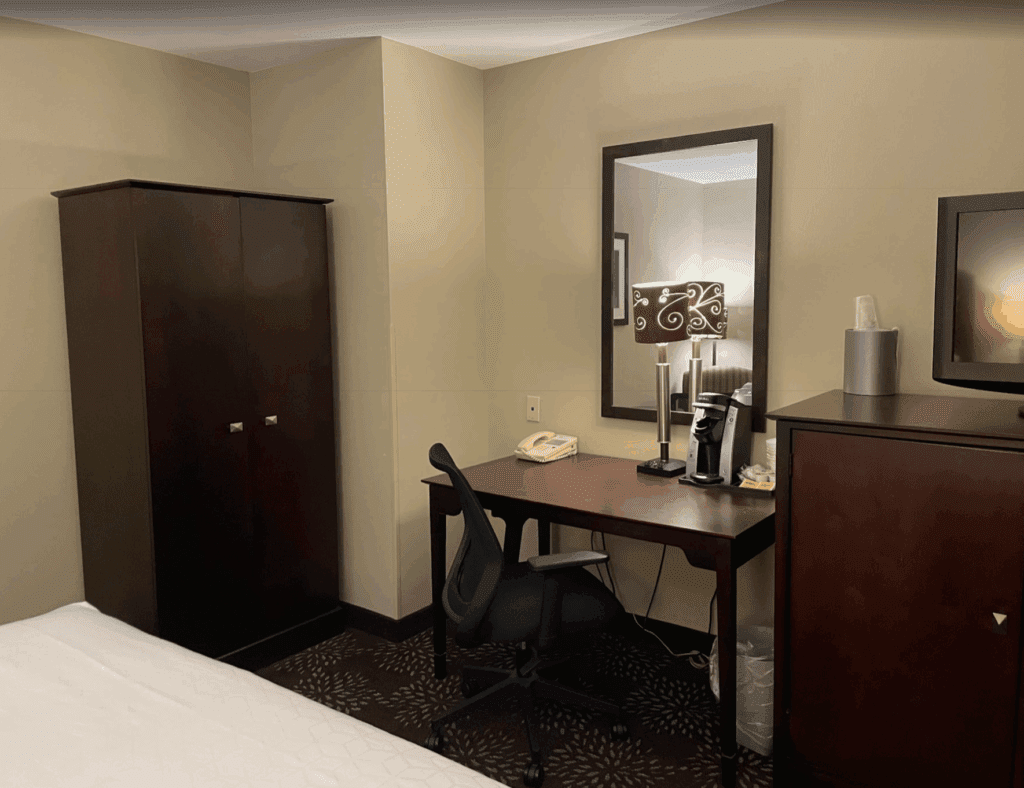 a desk and chair in a hotel room