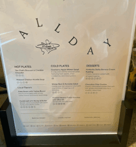 a menu sign in a black frame