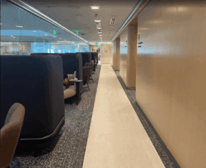 a hallway with chairs and a window