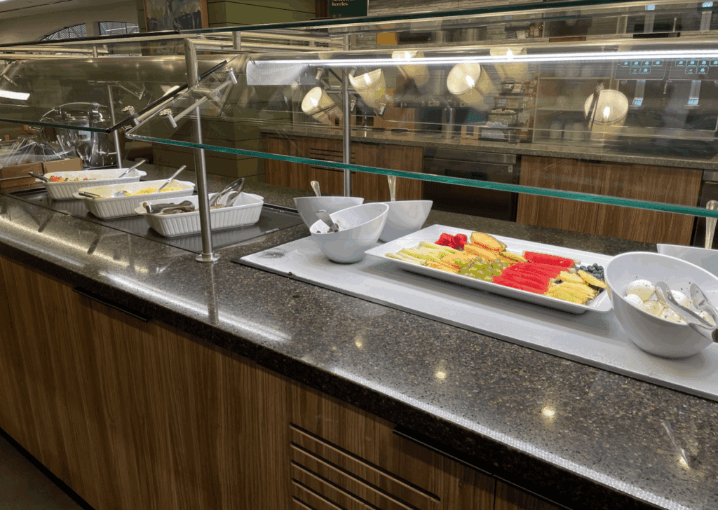 a buffet line with different types of food on it