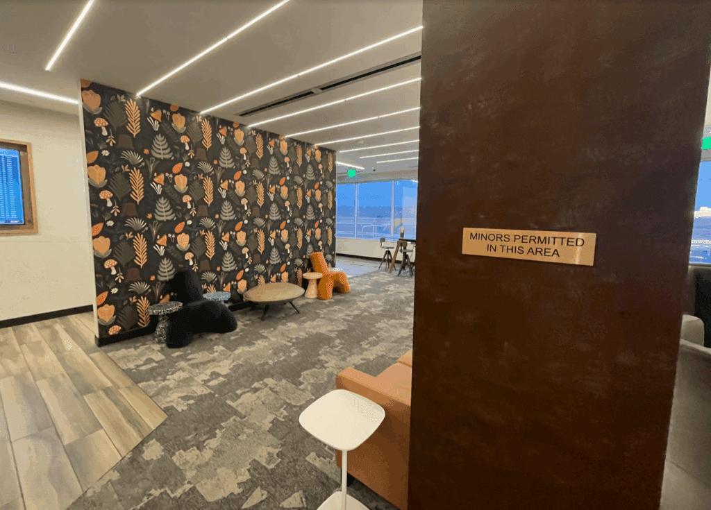 a room with a wallpaper and chairs