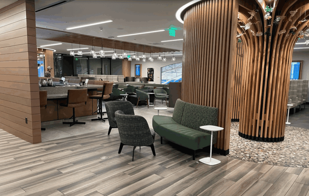 a room with a large column and chairs