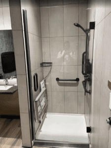 a shower with a mirror