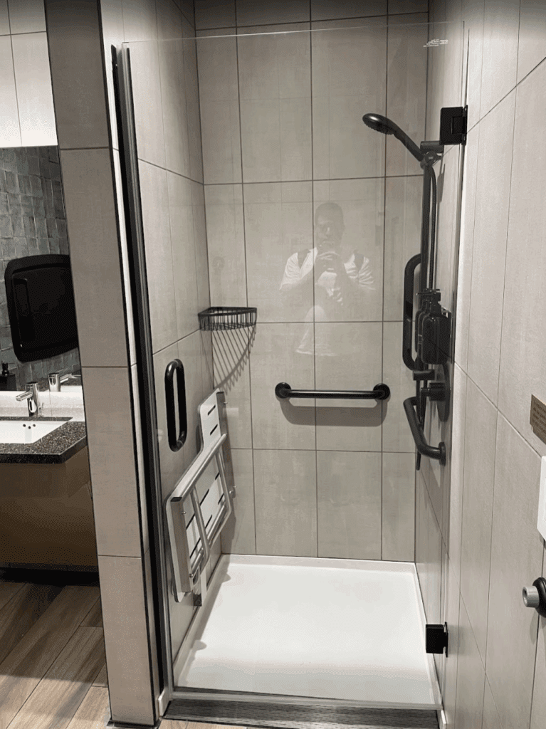 a shower with a mirror
