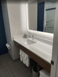 a bathroom with a mirror and sink