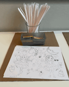 a coloring book and pencils on a table