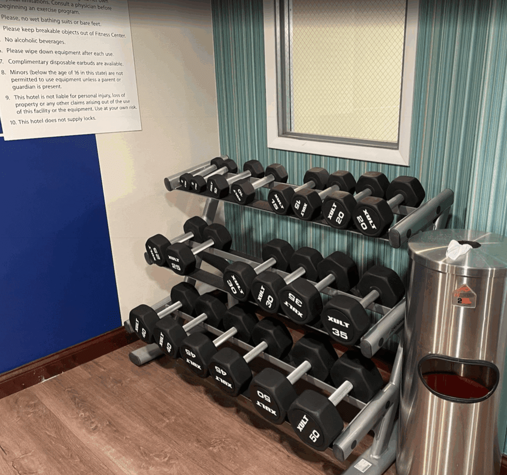 a rack of dumbbells in a room