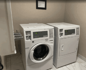 a washing machine and dryer in a room