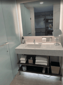 a bathroom with a mirror and a sink