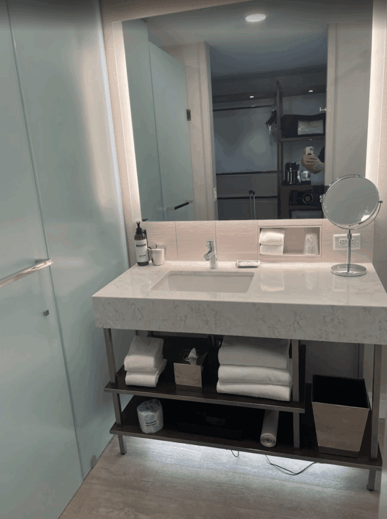 a bathroom with a mirror and a sink