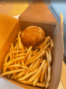 a burger and fries in a box