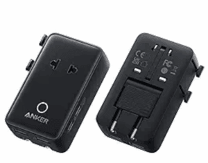 a black rectangular object with buttons and a couple of plugs