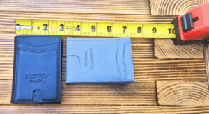 a blue wallets and a yellow tape measure