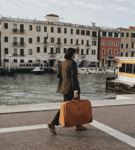 a man walking with a suitcase
