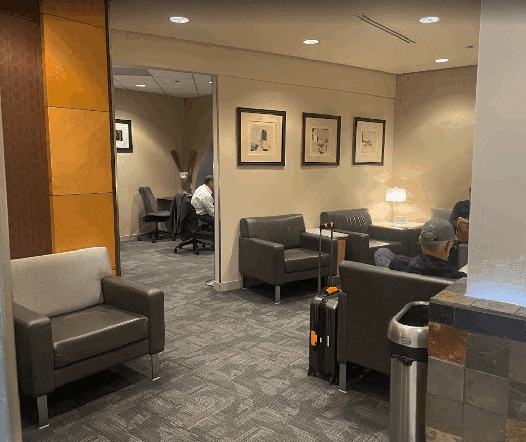 a room with chairs and a couple of men sitting in chairs