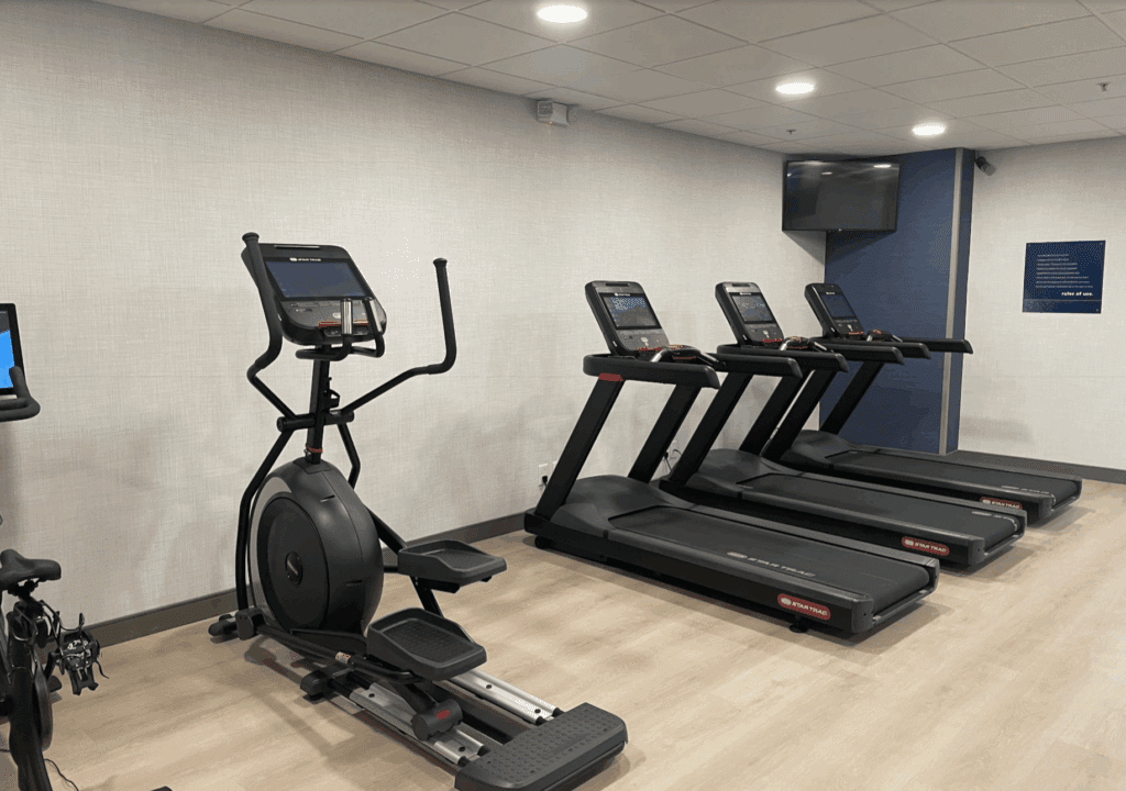 a room with treadmills and exercise machines