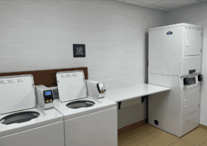 a laundry room with white appliances