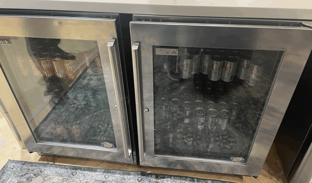 a refrigerator with cans of soda