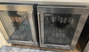 a refrigerator with cans of soda