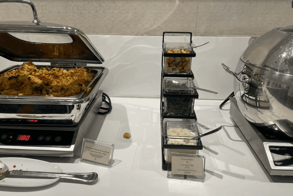 food in a buffet with a variety of food in containers