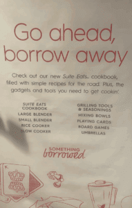 a white sign with red text