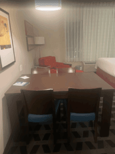 a table and chairs in a hotel room