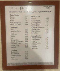 a menu board with a brown frame