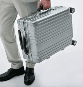 a person carrying a suitcase