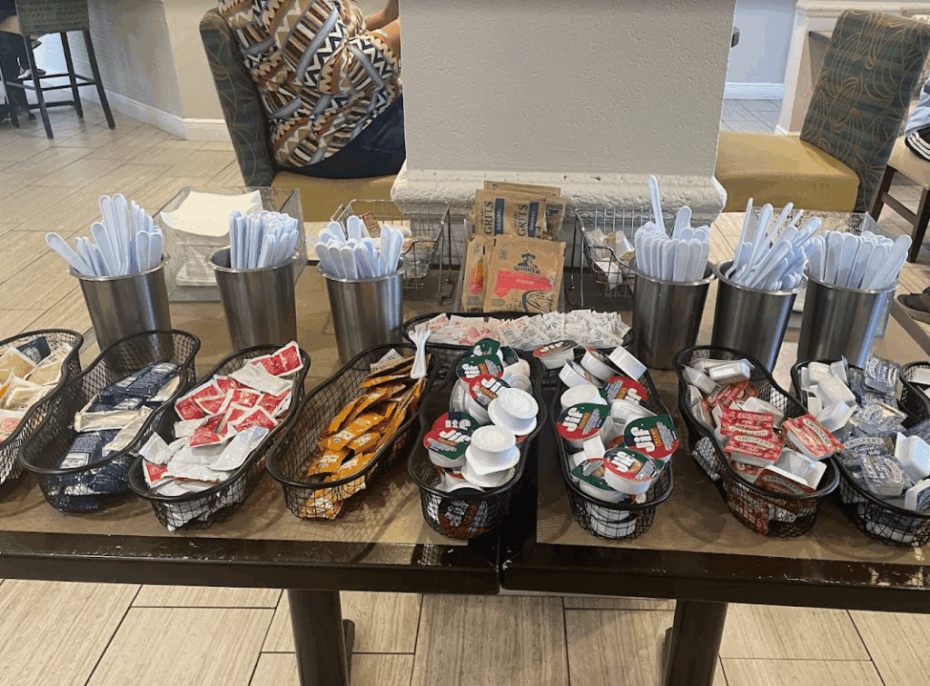 a table with a group of containers of food and utensils
