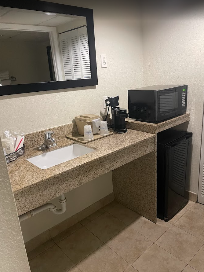 a bathroom sink and microwave