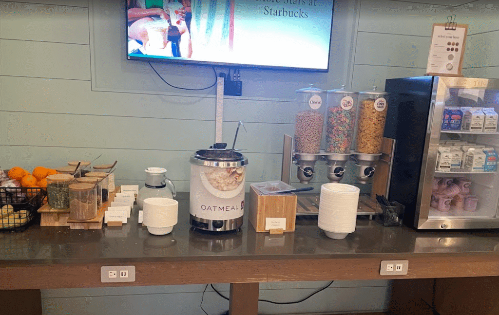 a breakfast buffet with a television and a coffee machine