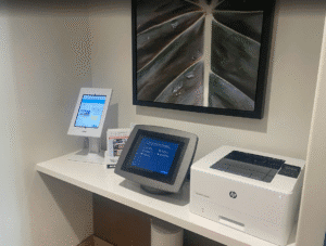a computer and printer on a desk