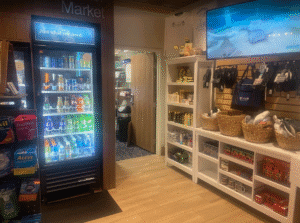 a store with shelves of beverages and a television