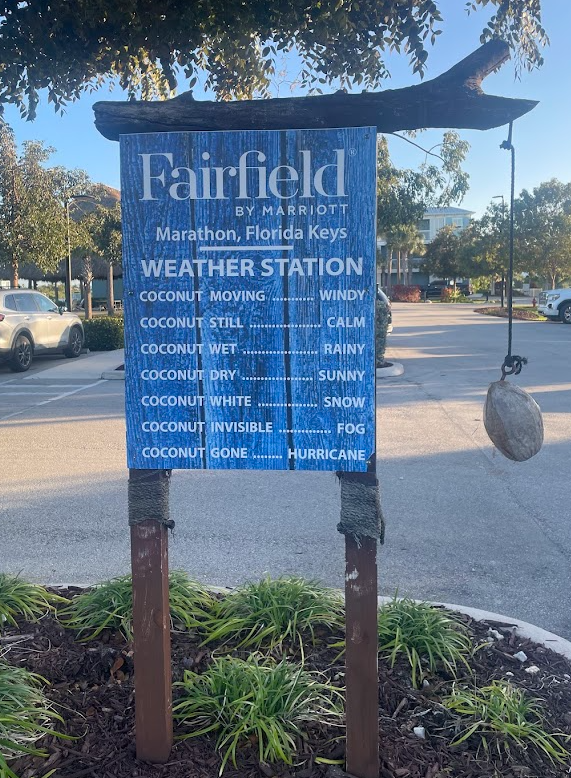 a sign with a rope attached to it