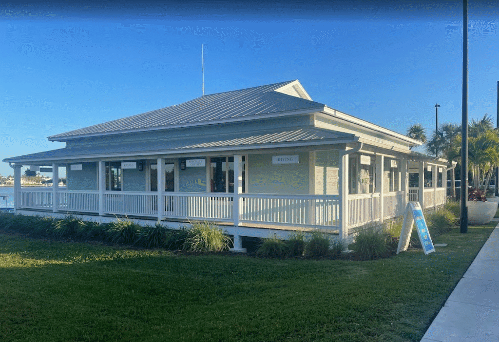 a building with a porch and a sign