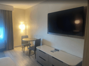 a room with a television and table