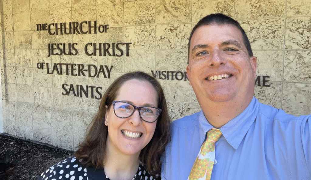 a man and woman smiling for a picture