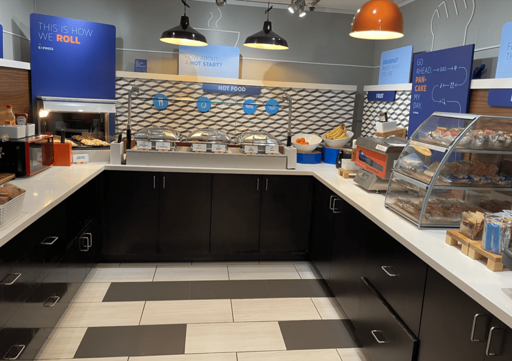 a food court with black cabinets and black counter tops
