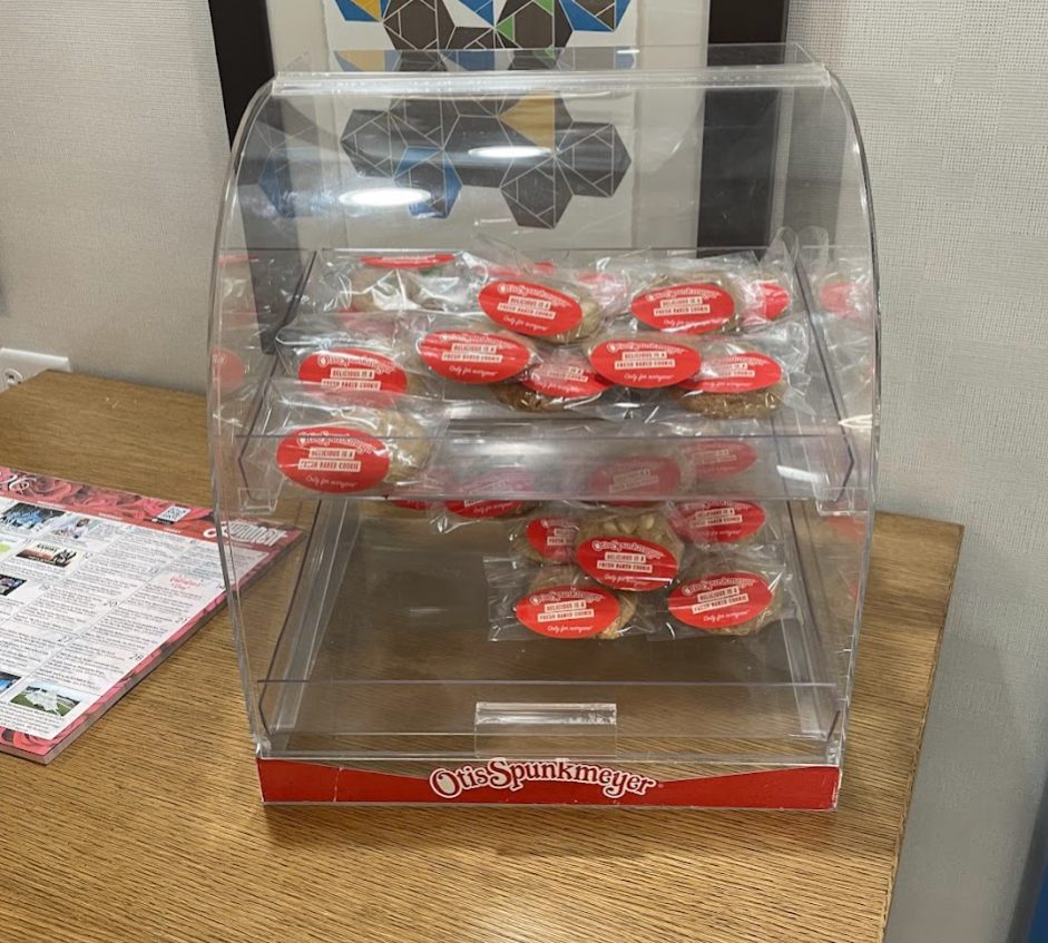 a clear display case with red and white wrappers on top