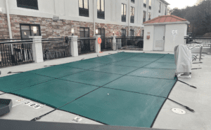 a pool with a tarp on the ground