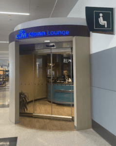 a glass door with a sign in front of it