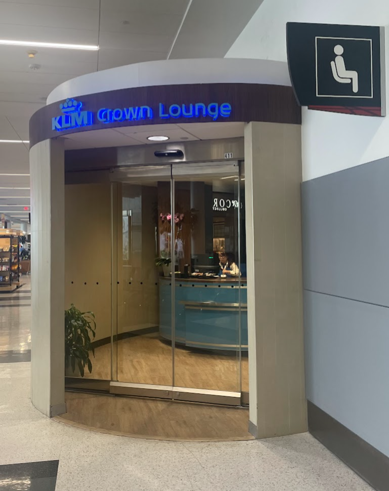 a glass door with a sign in front of it