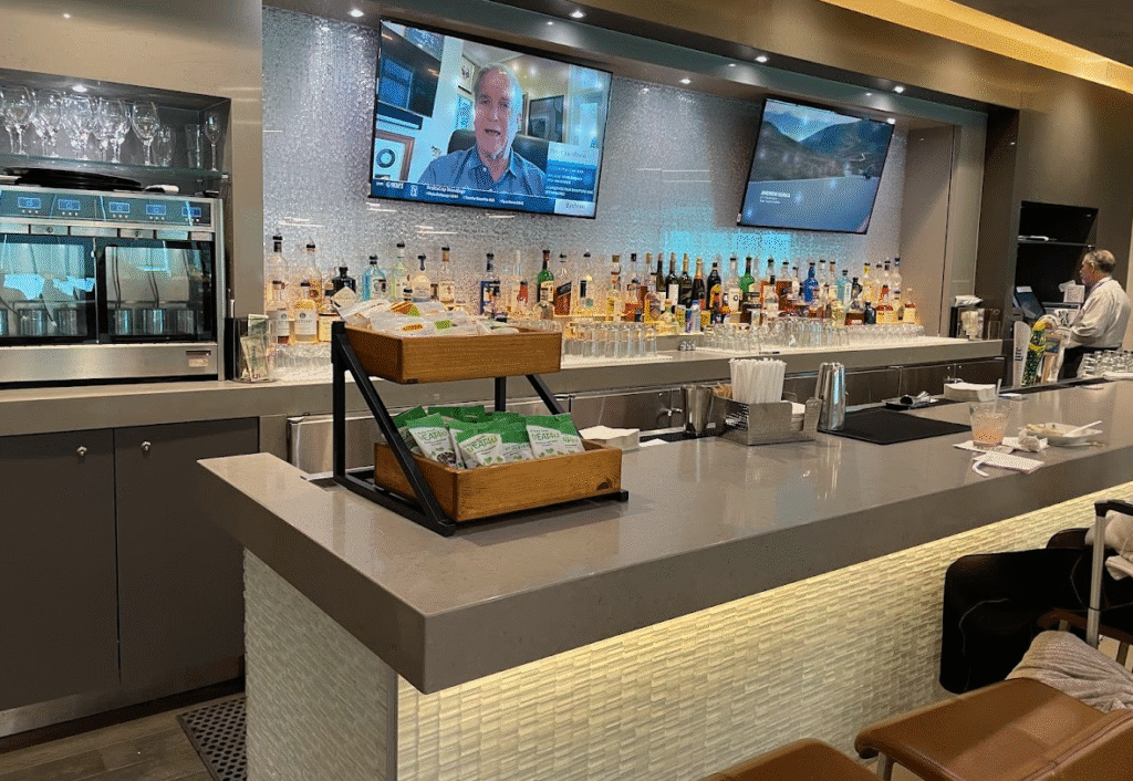 a bar with a television and a television on the wall