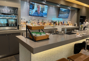 a bar with a television and a television on the wall